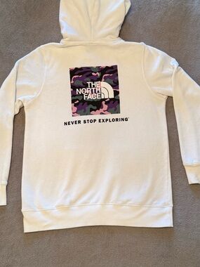 The North Face | Women’s White Pullover Hoodie with Black Logo and Purple Camo